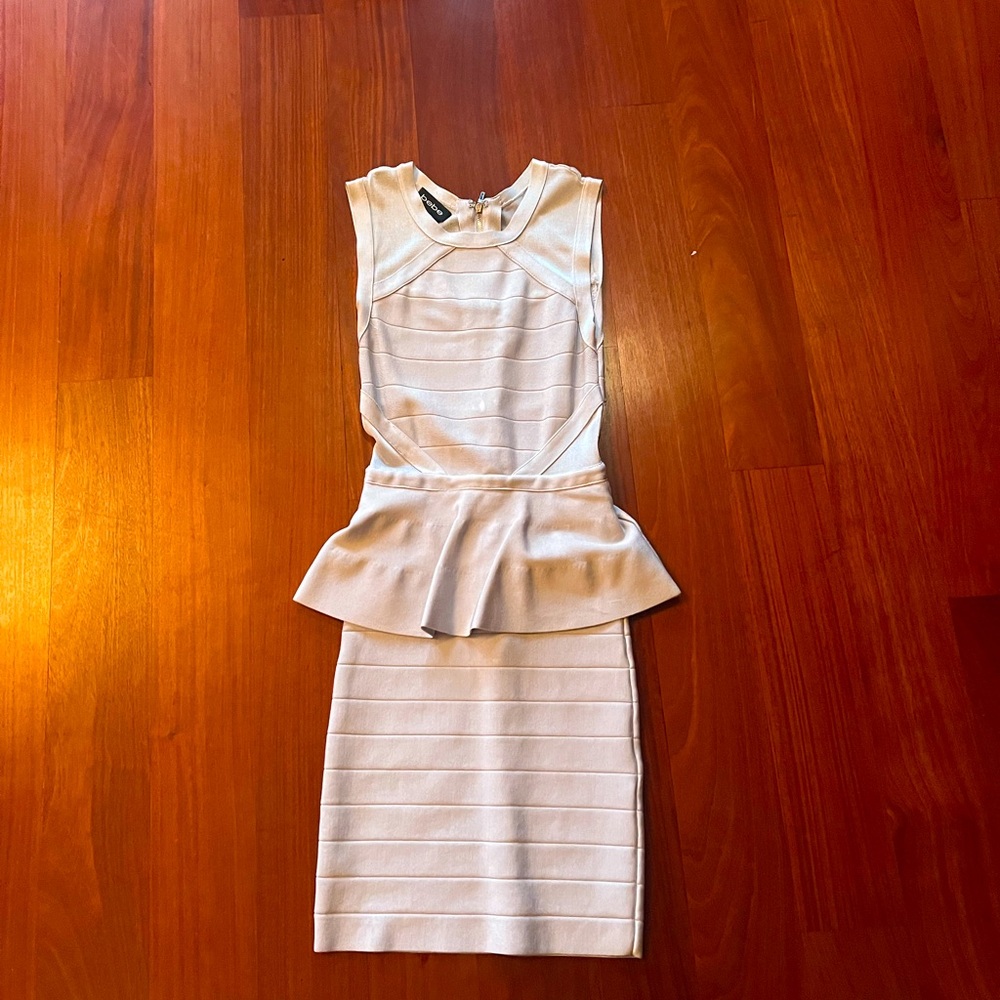Bebe peplum bandage dress in cream/grey